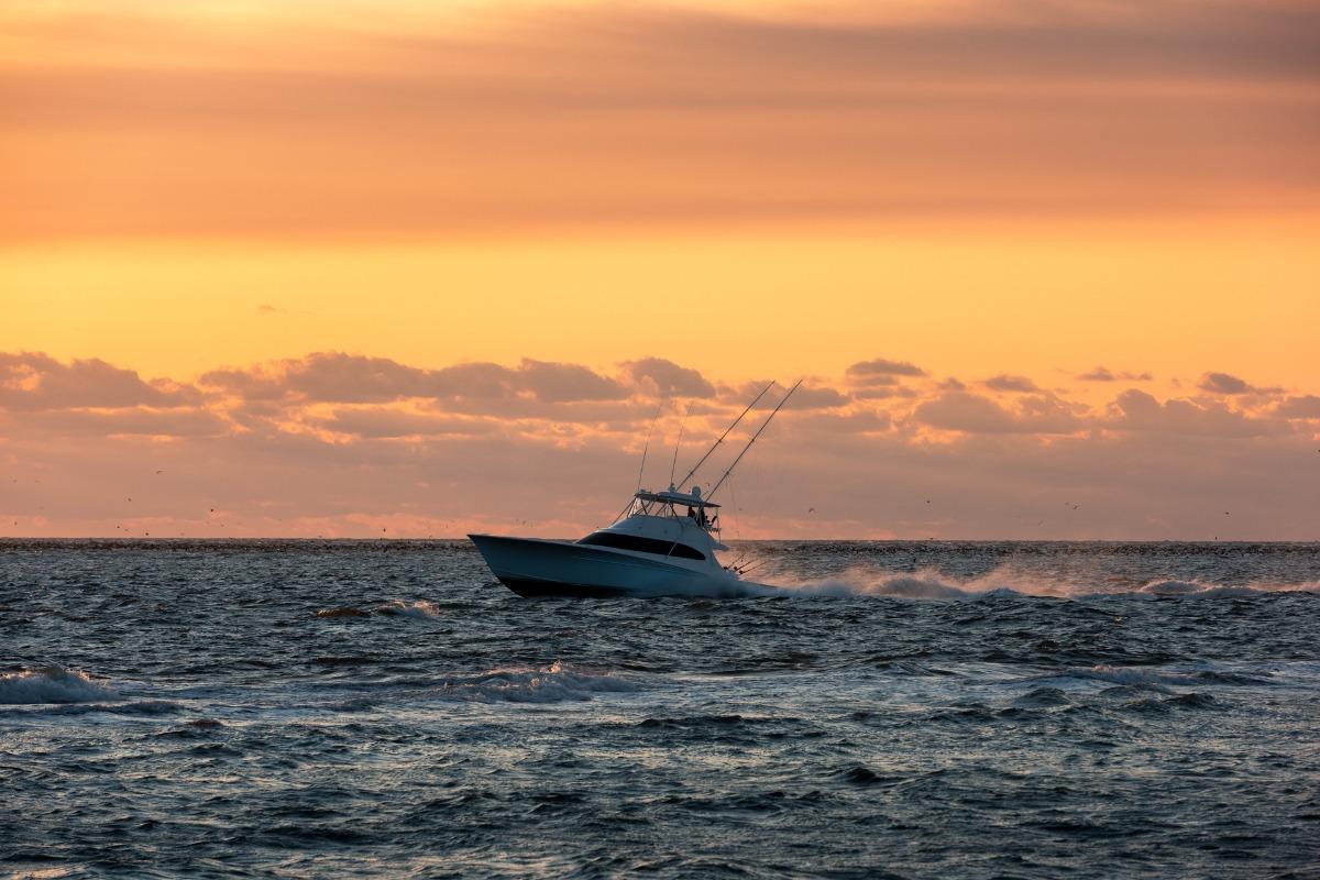 Fishing Charter Boat on the Outer Banks in late summer navigating Oregon Inlet on the coast of North Carolina